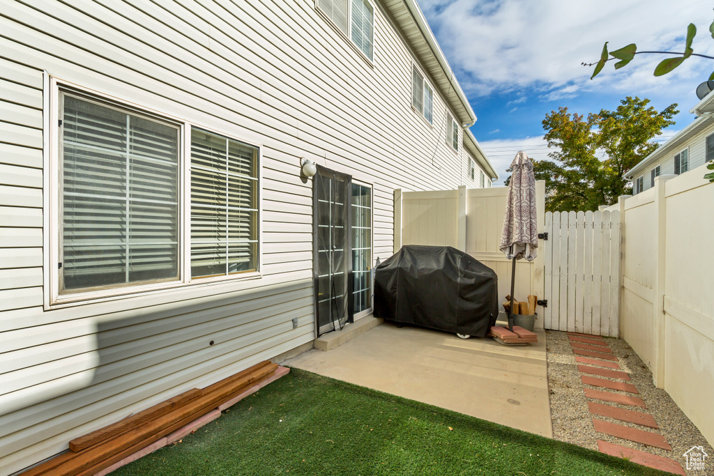 View of patio / terrace with area for grilling and fence