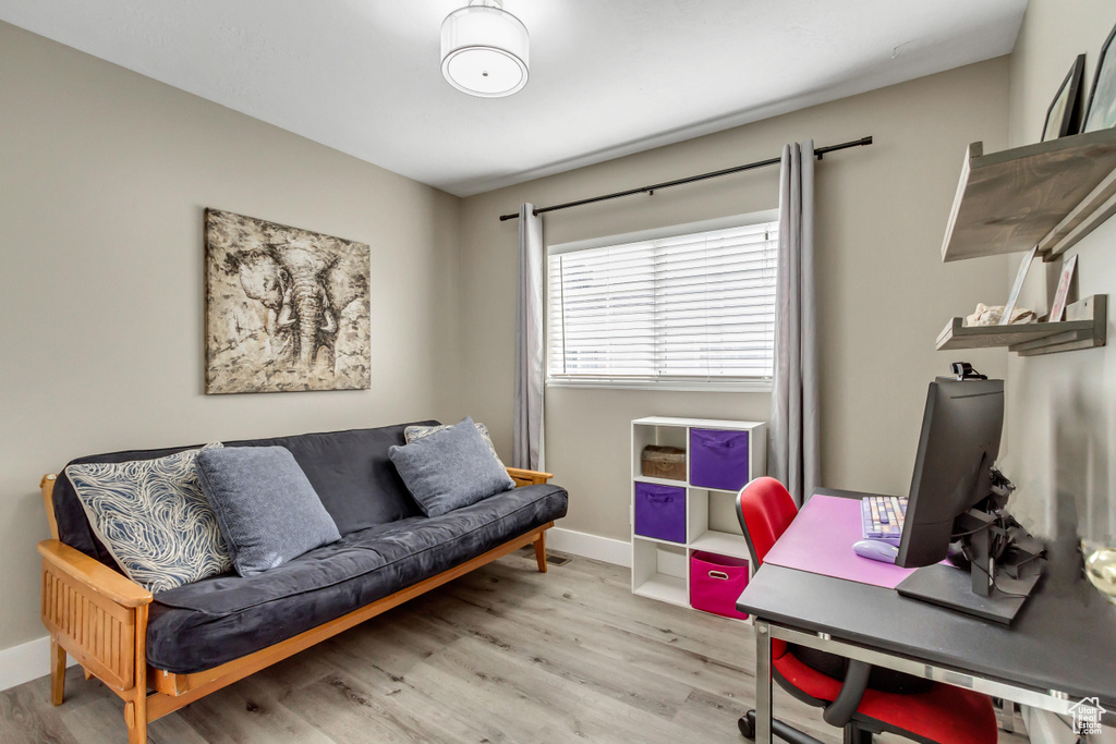 Office area featuring wood finished floors and baseboards