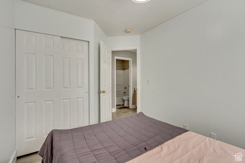 Bedroom featuring a closet and wood finished floors