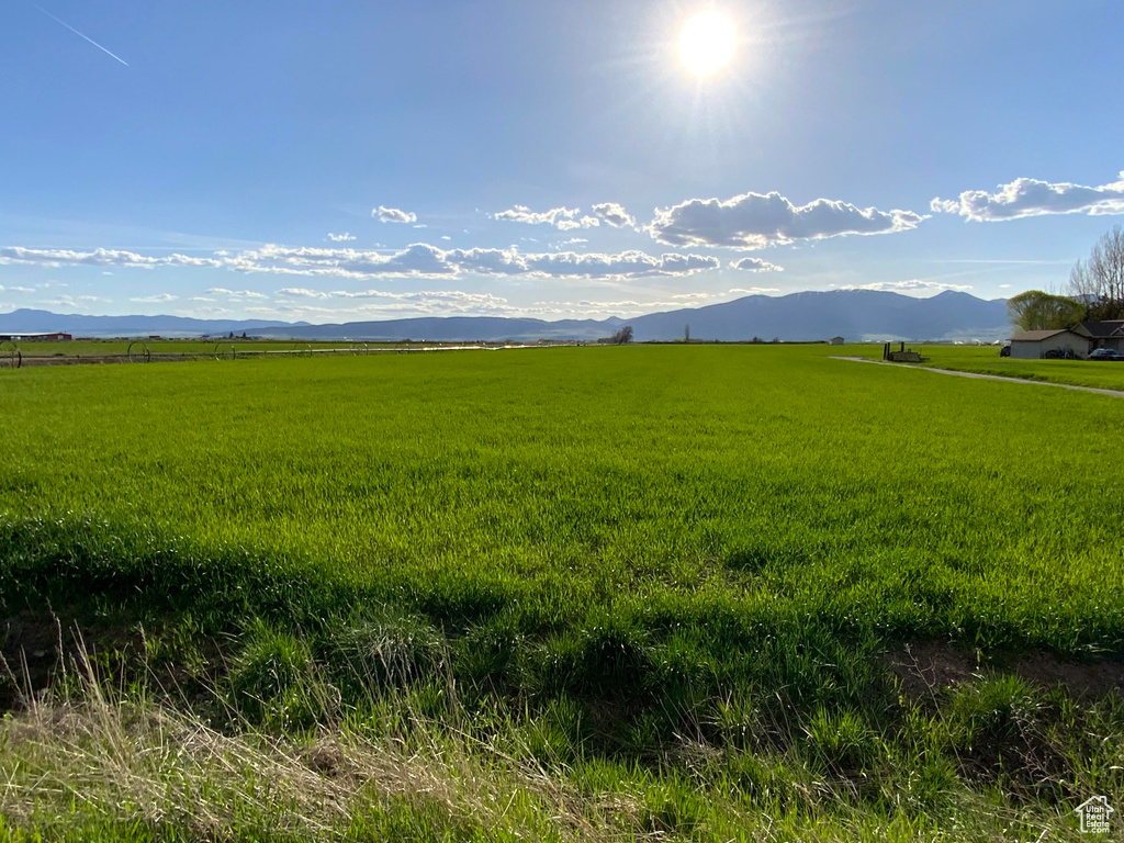 View of mountain backdrop with rural landscape