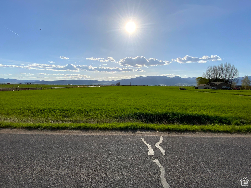 View of asphalt street featuring a mountain view and a rural view