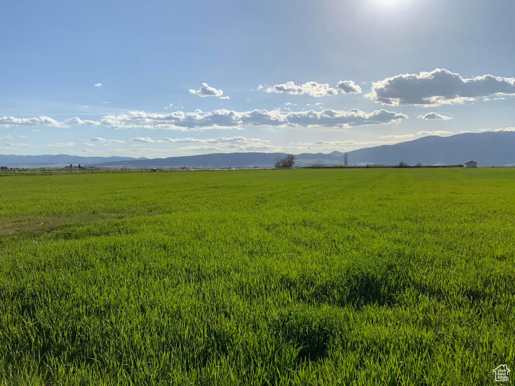 View of mountain backdrop featuring rural landscape and a pastoral area