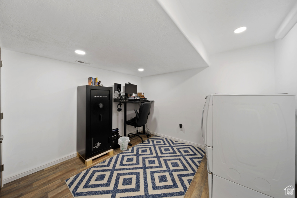 Home office with baseboards, wood finished floors, recessed lighting, and washer and dryer