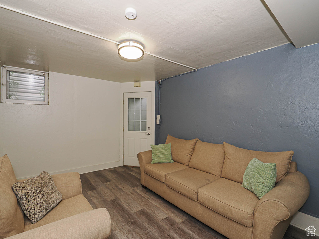 Living room featuring wood finished floors and baseboards