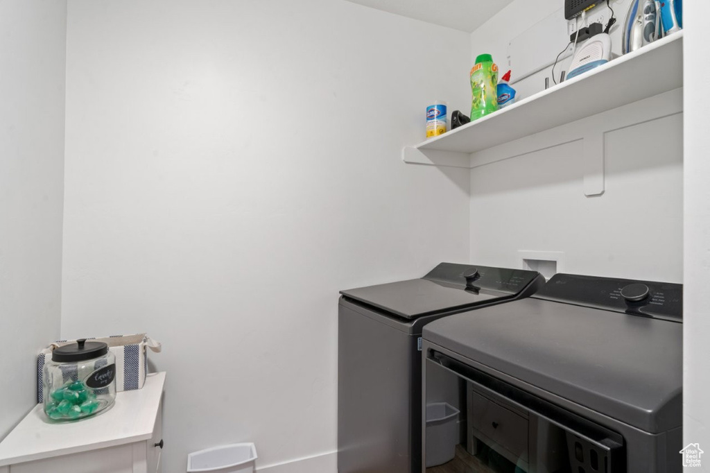 Laundry room featuring separate washer and dryer