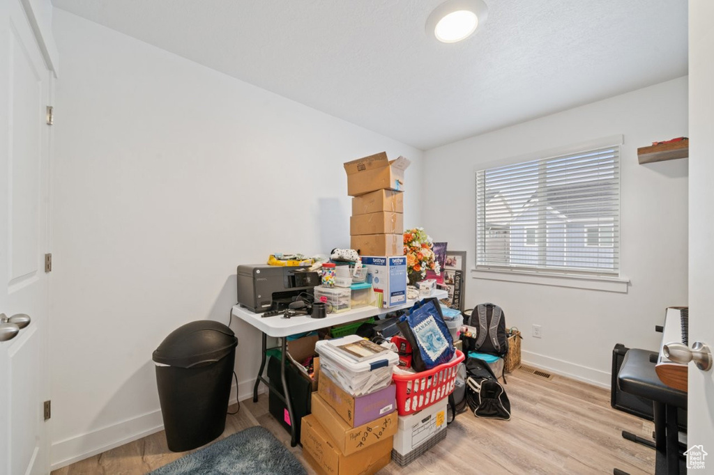 Office featuring baseboards and wood finished floors