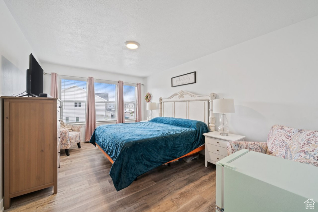 Bedroom with light wood-style floors