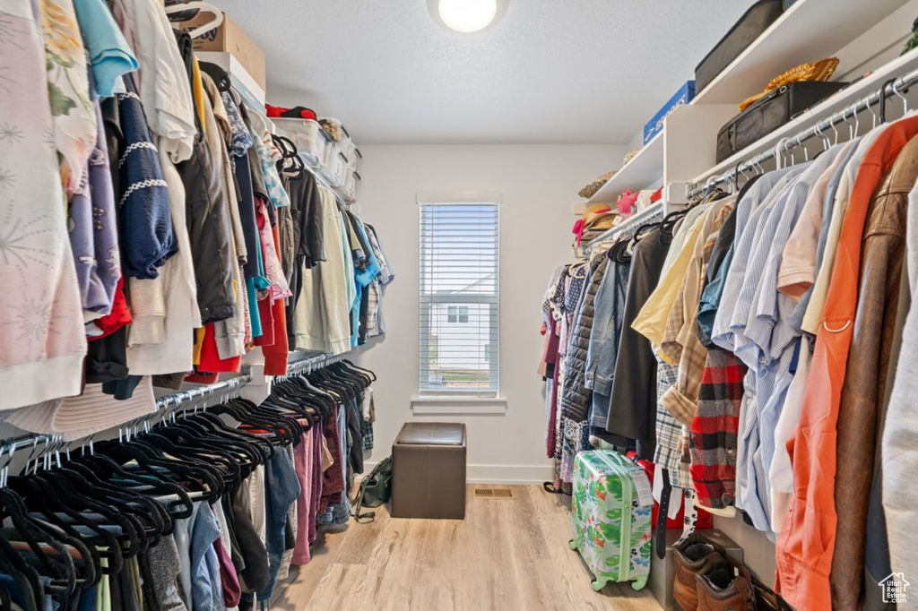 Walk in closet featuring wood finished floors