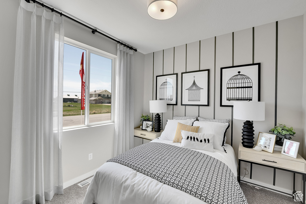 Carpeted bedroom with baseboards
