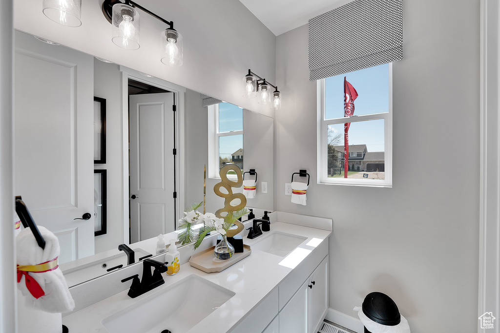 Full bath featuring double vanity