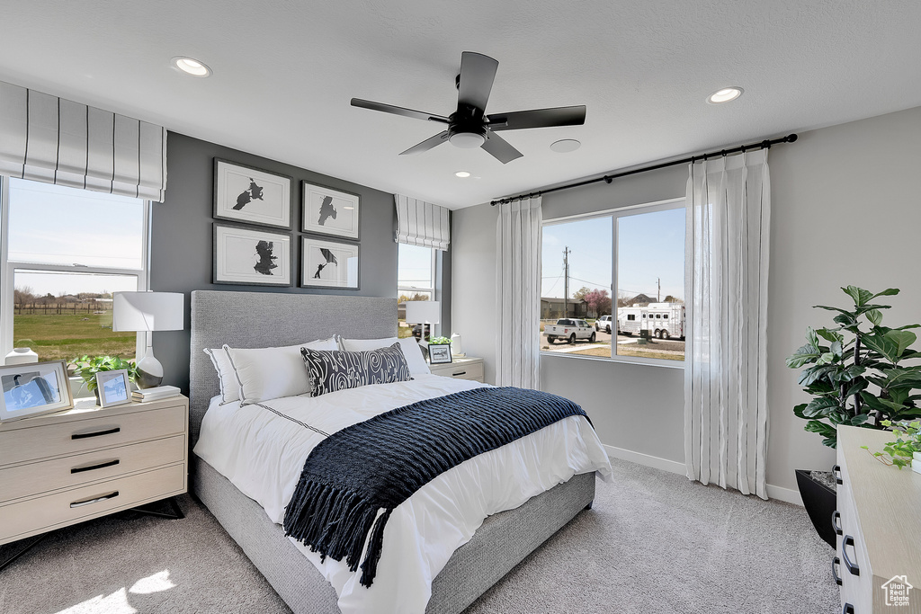 Carpeted bedroom with recessed lighting, baseboards, and a ceiling fan