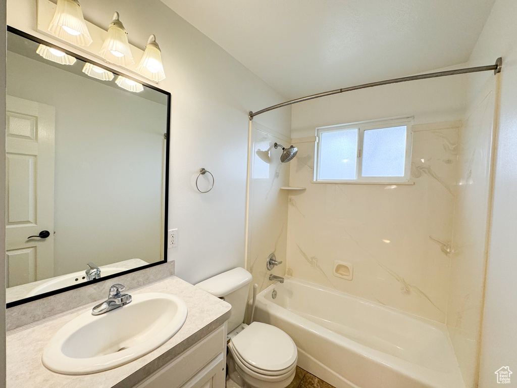 Full bath with shower / tub combination, toilet, and vanity