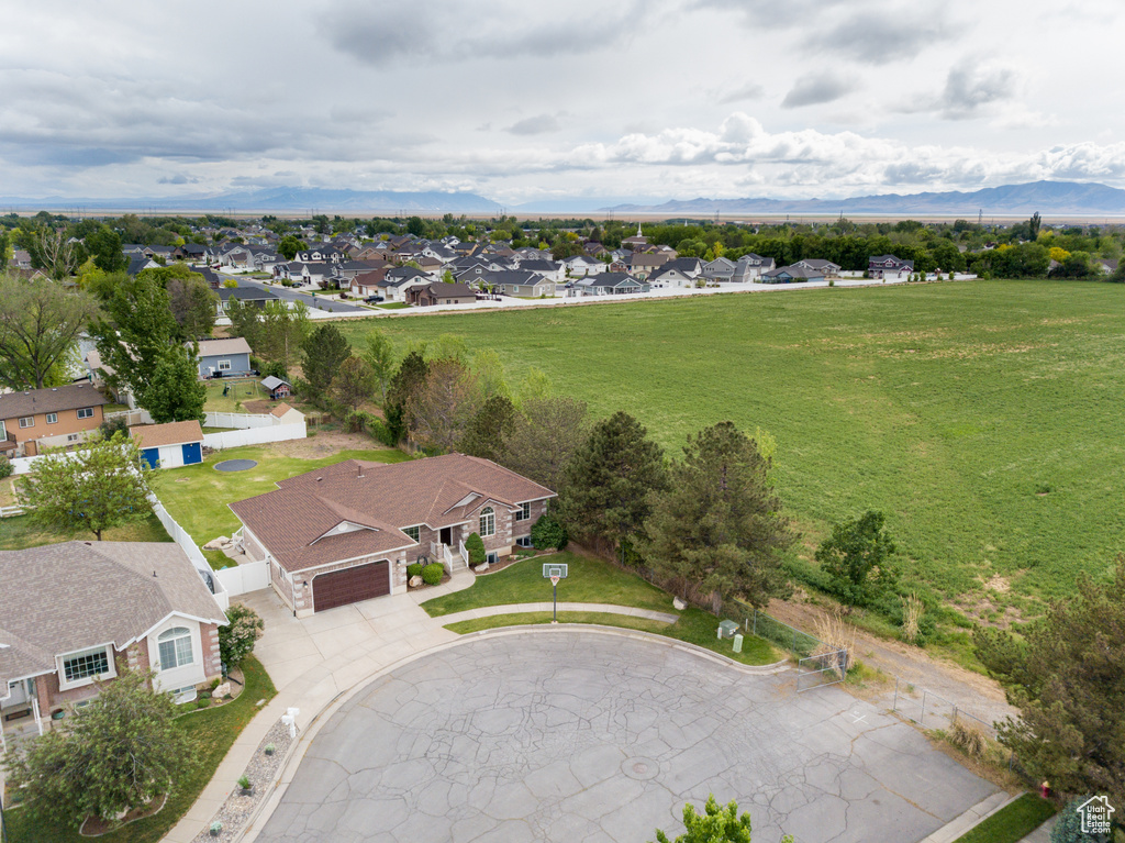 Aerial view of residential area featuring a mountain backdrop