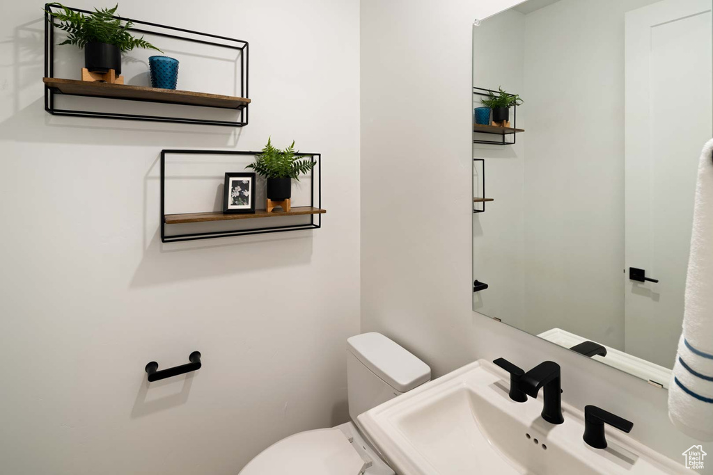 Bathroom featuring toilet and a sink