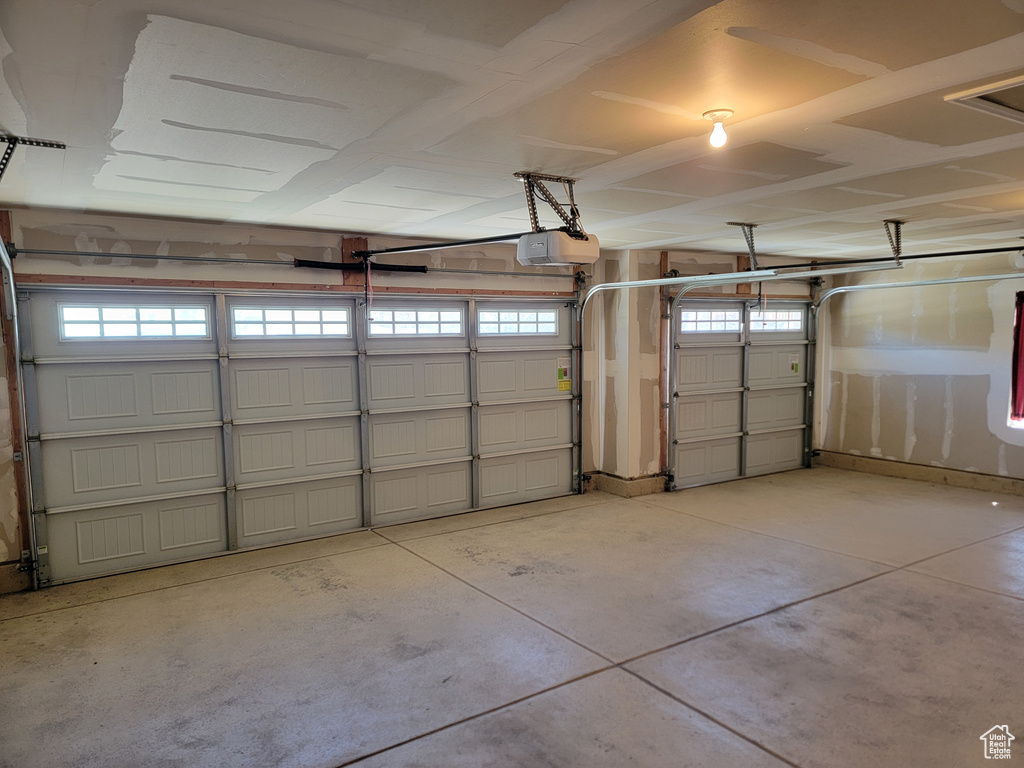 Garage featuring a garage door opener