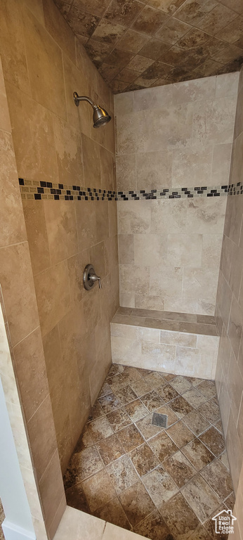Full bath with a tile shower