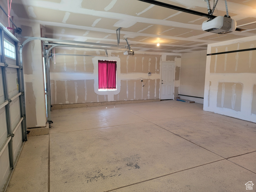 Garage featuring a garage door opener