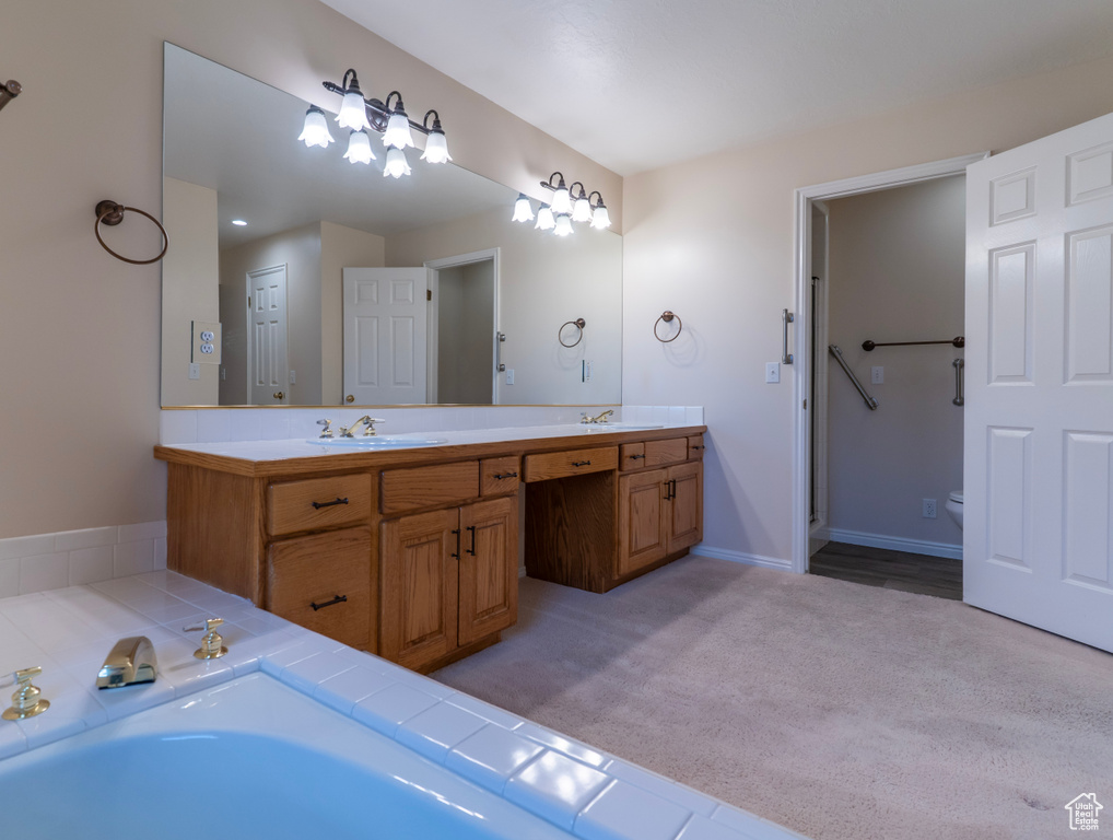 Bathroom with double vanity and toilet