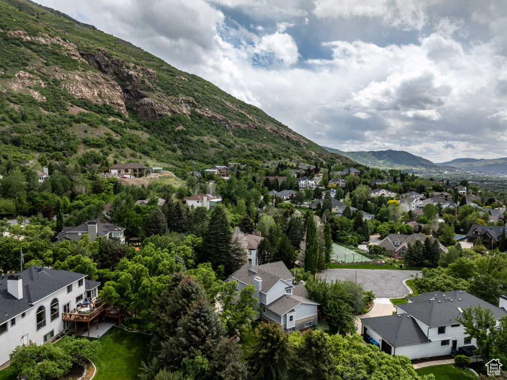 Aerial perspective of suburban area featuring a mountain backdrop