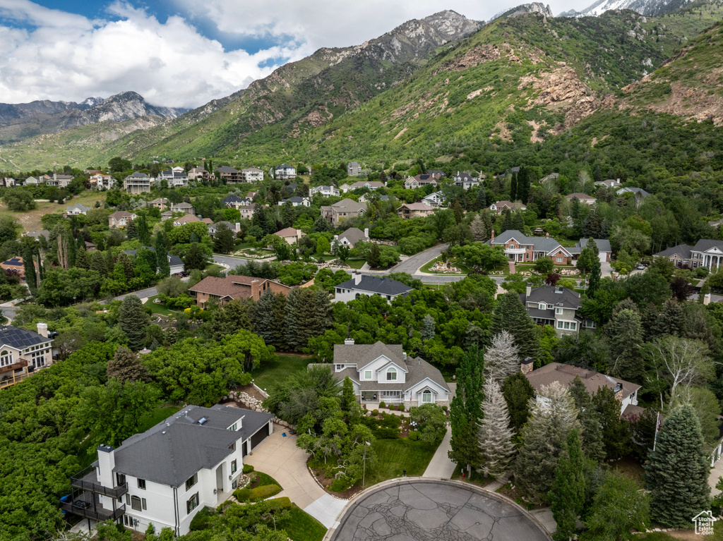 Aerial perspective of suburban area featuring a mountainous background