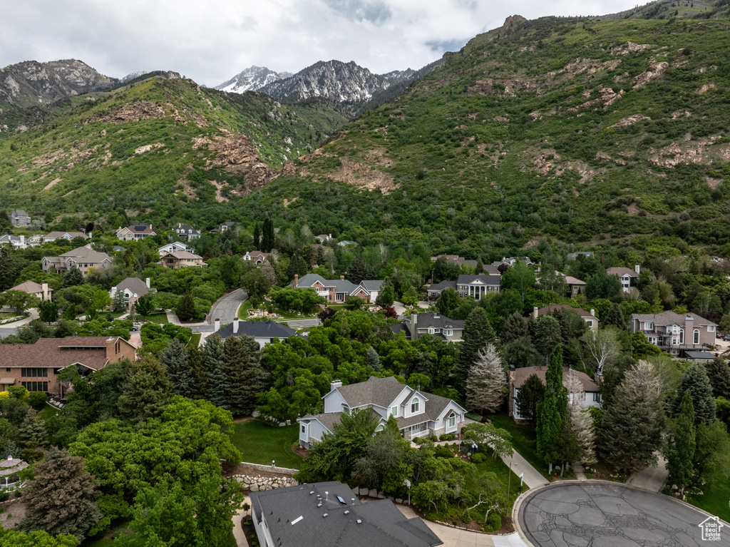 Aerial view of residential area featuring a mountainous background