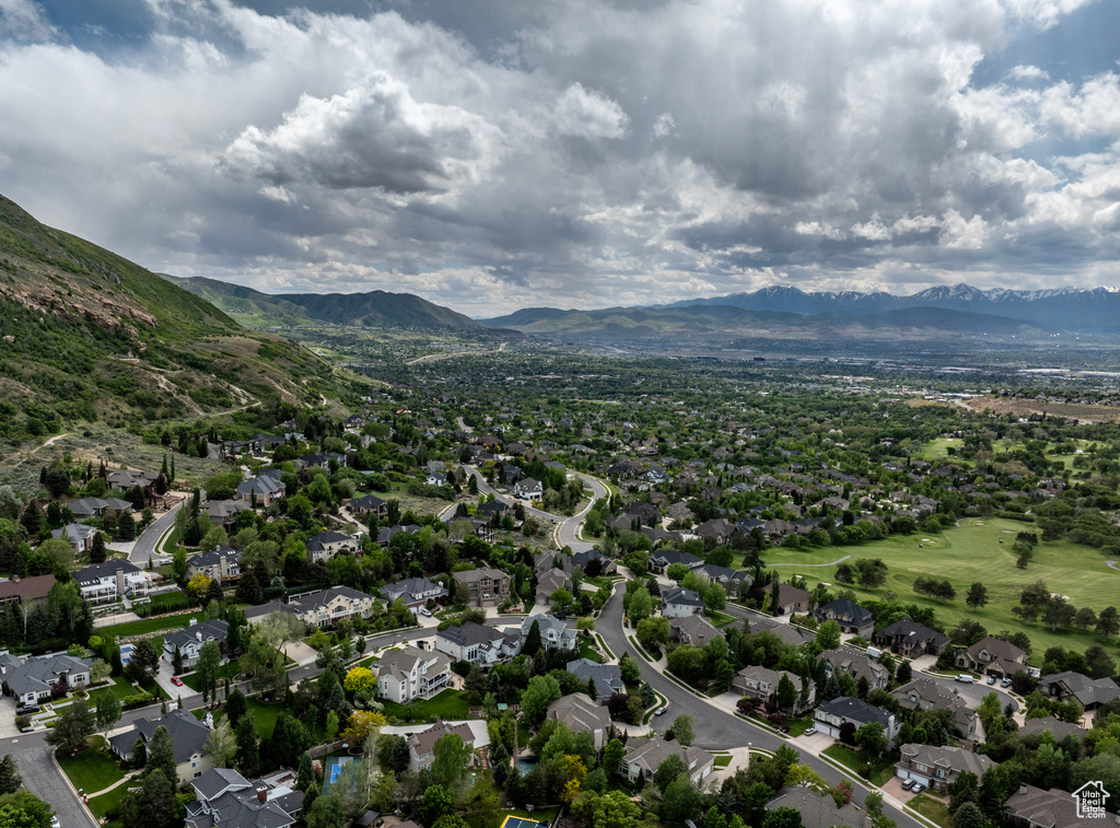 Aerial perspective of suburban area featuring a mountain backdrop