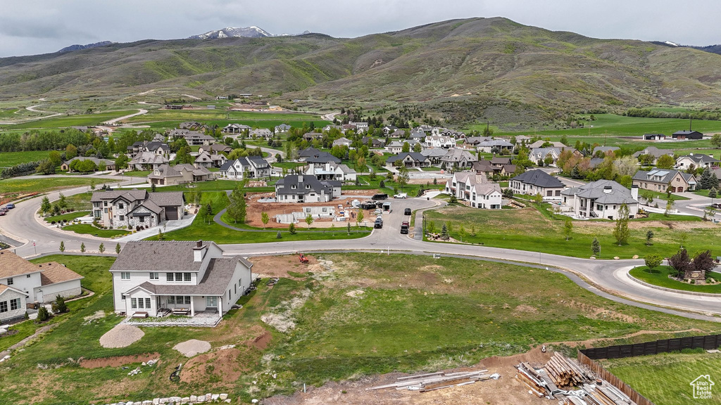 View of property location featuring nearby suburban area and mountains