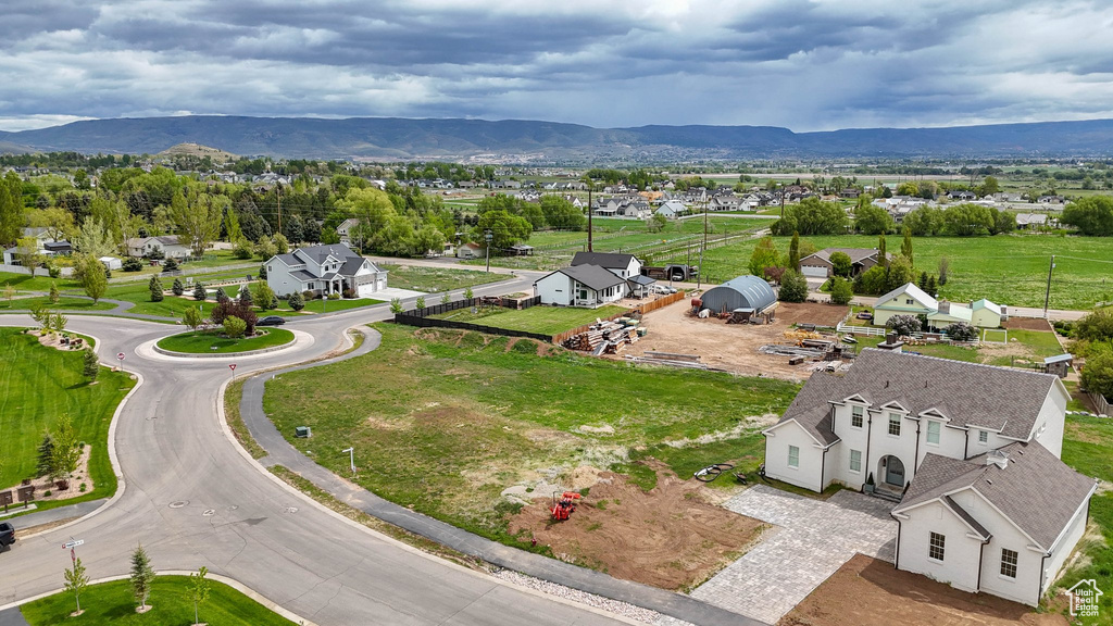 Aerial view of residential area featuring a mountain backdrop