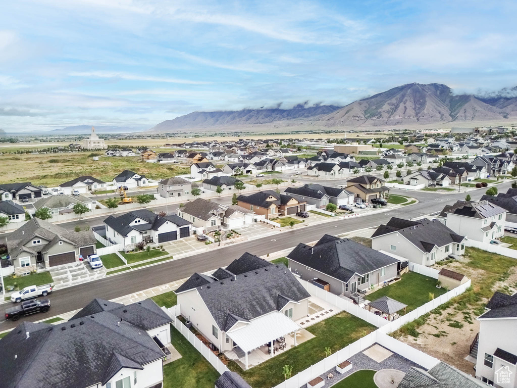 Aerial view of residential area featuring a mountain backdrop