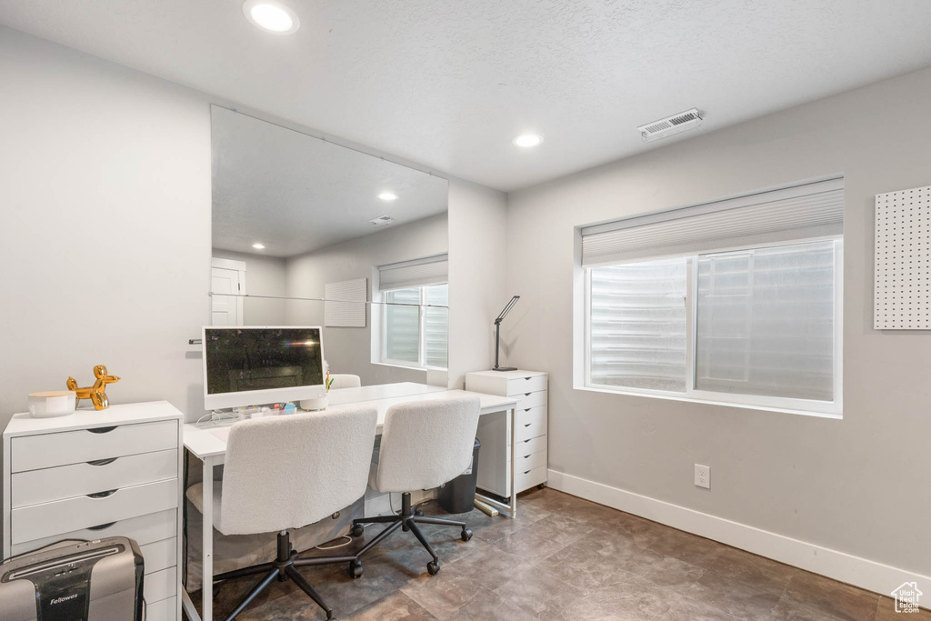 Office space with baseboards and recessed lighting