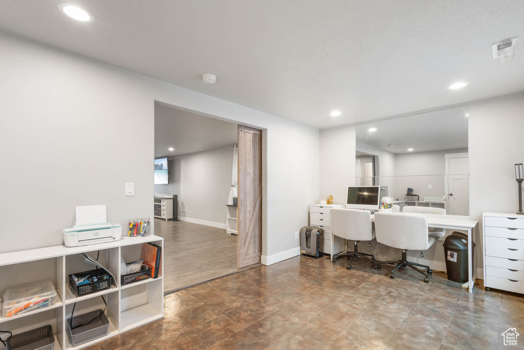 Office with recessed lighting and baseboards