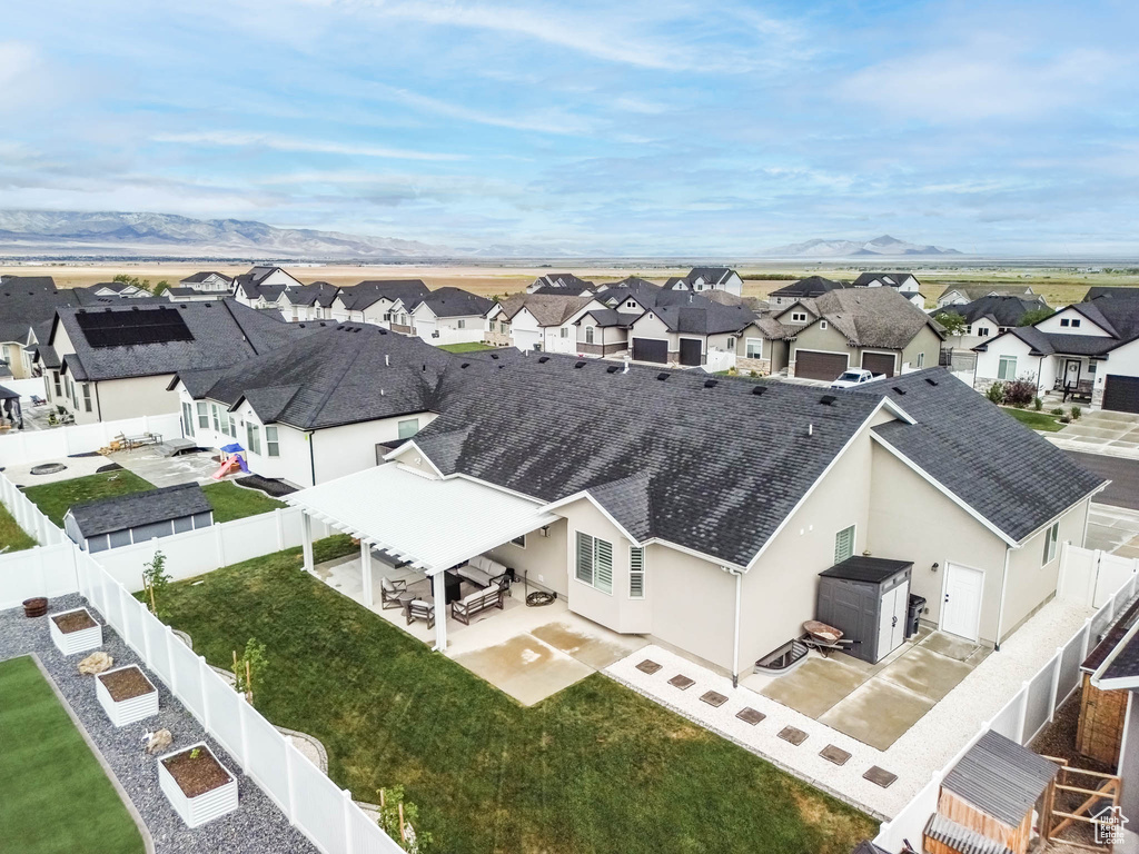 Aerial perspective of suburban area with a mountain backdrop