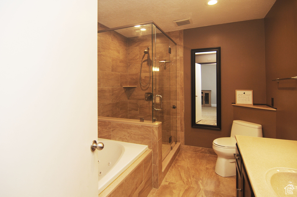 Full bathroom with vanity, a shower stall, tiled tub, toilet, and recessed lighting
