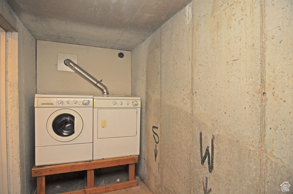 Laundry room featuring washing machine and clothes dryer