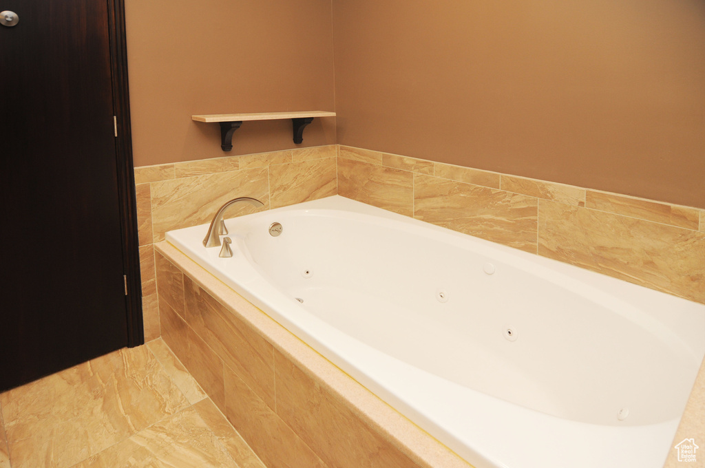 Full bathroom with a jetted tub