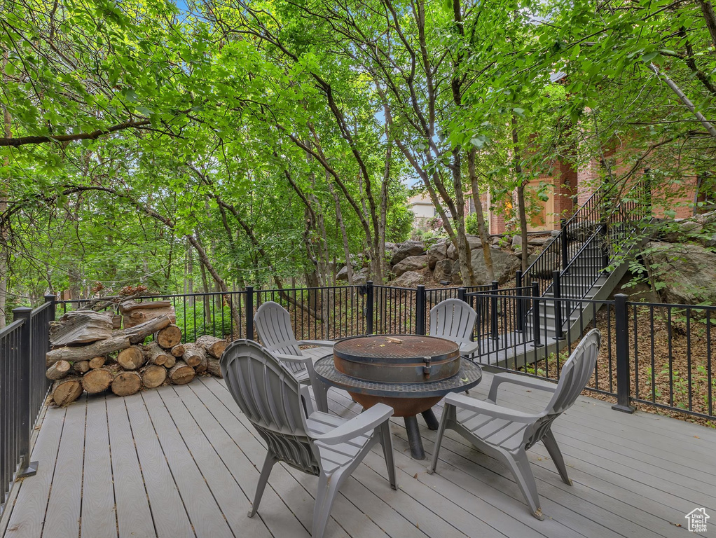 Deck with a fire pit and stairway