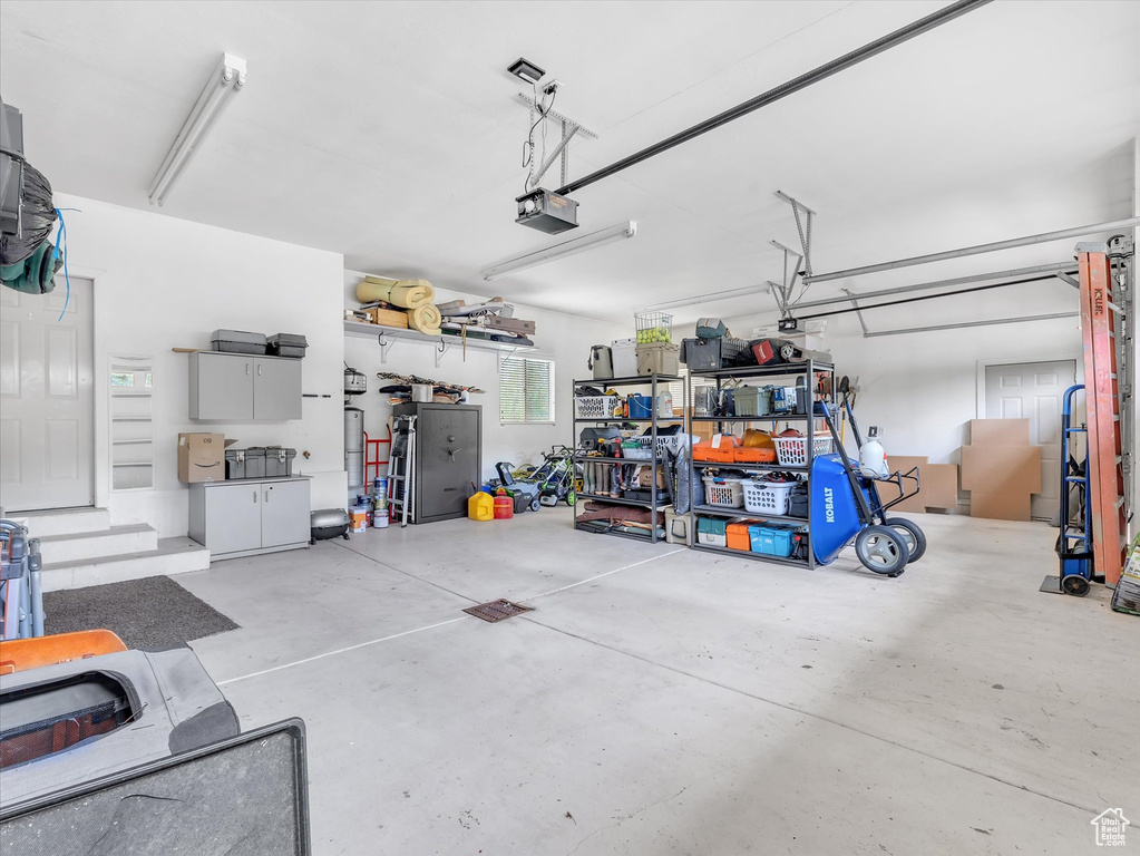 Garage featuring a garage door opener