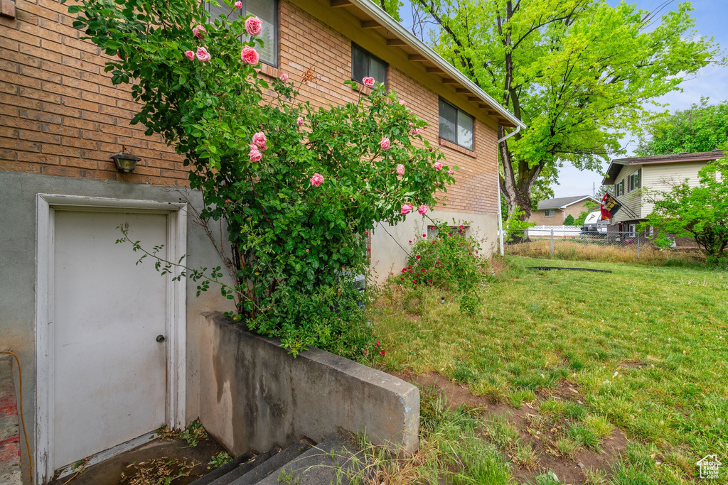 View of property exterior featuring brick siding
