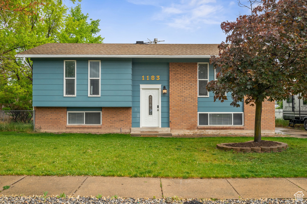 Bi-level home with brick siding