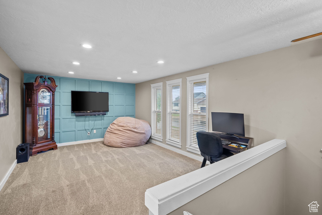 Carpeted office space with baseboards, recessed lighting, ceiling fan, and a textured ceiling