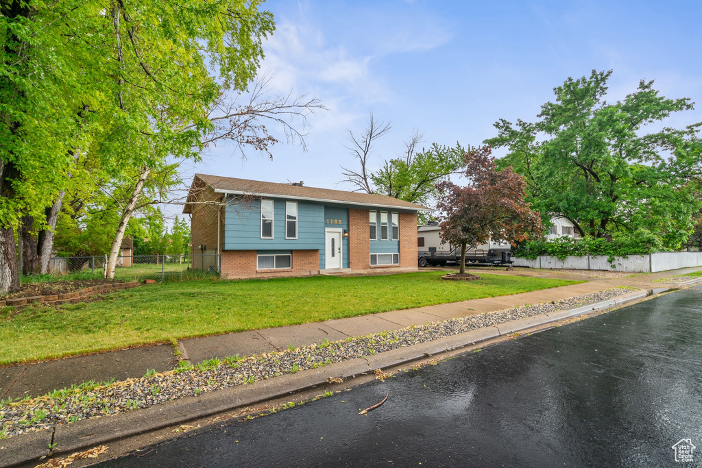 Raised ranch with brick siding