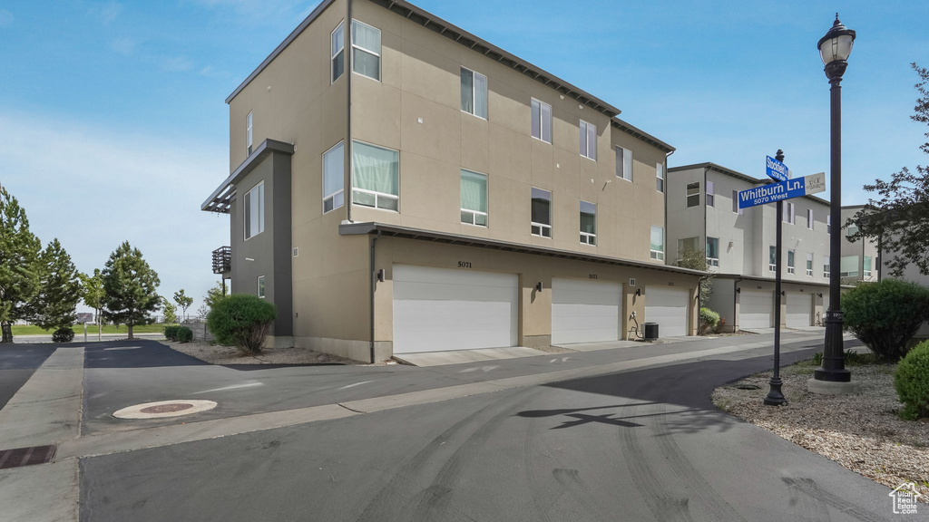 View of property with a garage