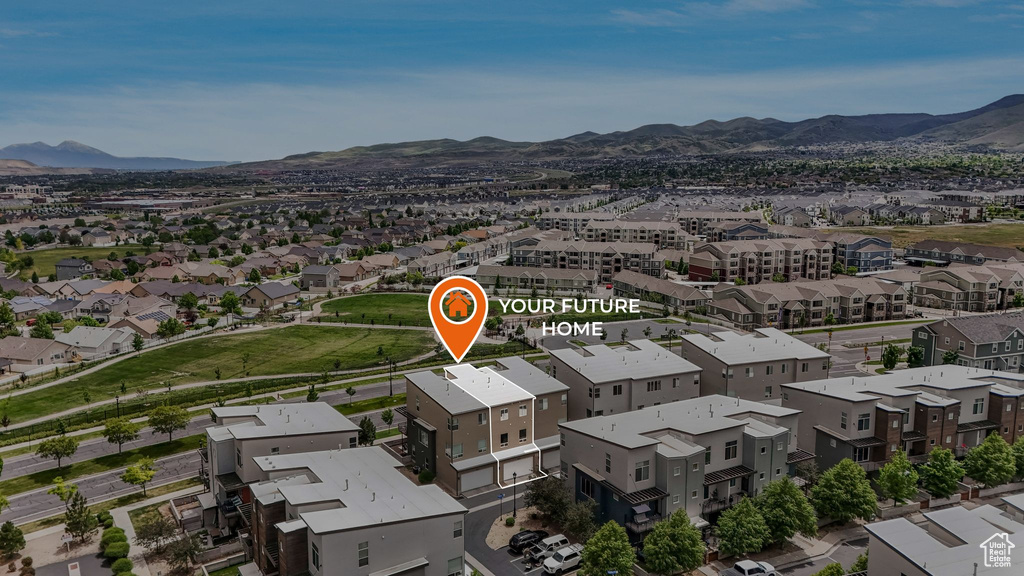 Aerial view of residential area with a mountain backdrop