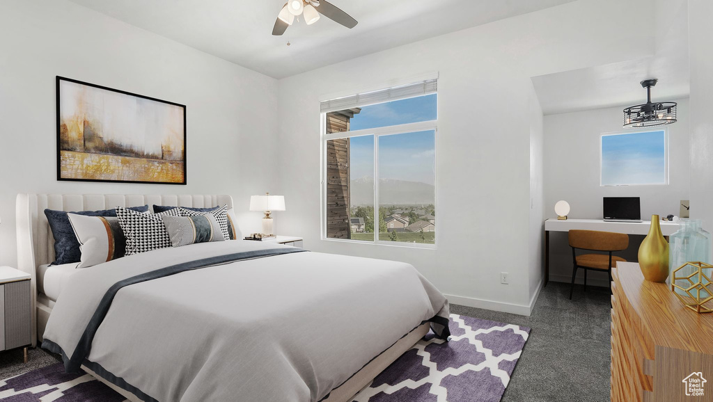 Carpeted bedroom featuring multiple windows, baseboards, and a ceiling fan