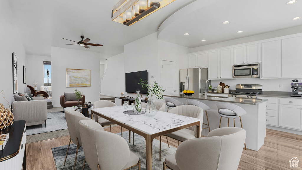 Dining area featuring recessed lighting, a ceiling fan, and light wood-style floors