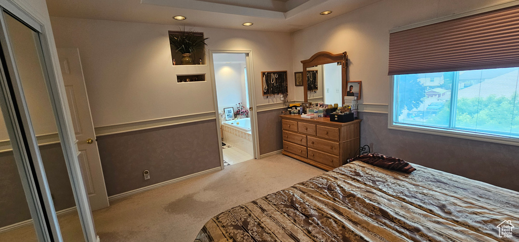 Carpeted bedroom with recessed lighting
