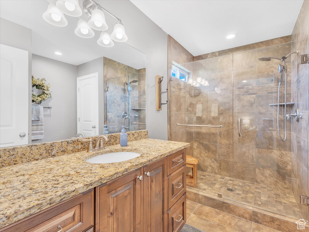 Bathroom with a shower stall and vanity