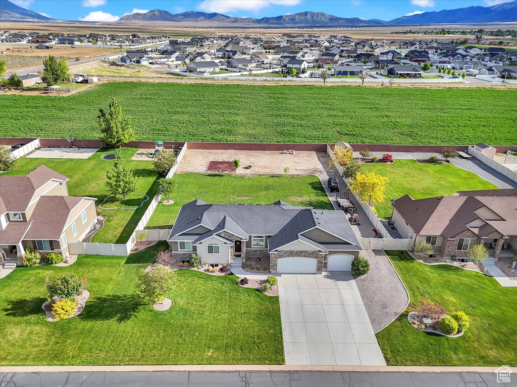 Aerial view of residential area featuring mountains