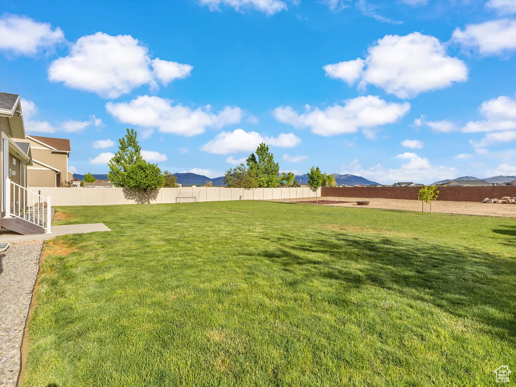View of yard with a mountain view