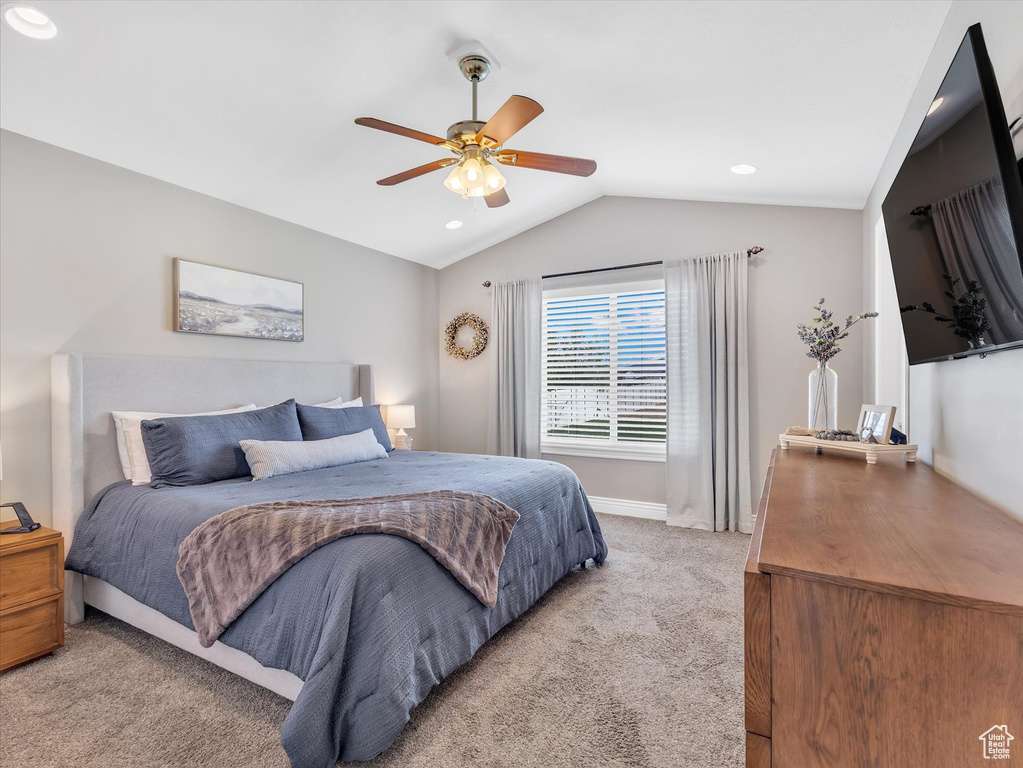 Bedroom featuring light colored carpet, vaulted ceiling, a ceiling fan, baseboards, and recessed lighting